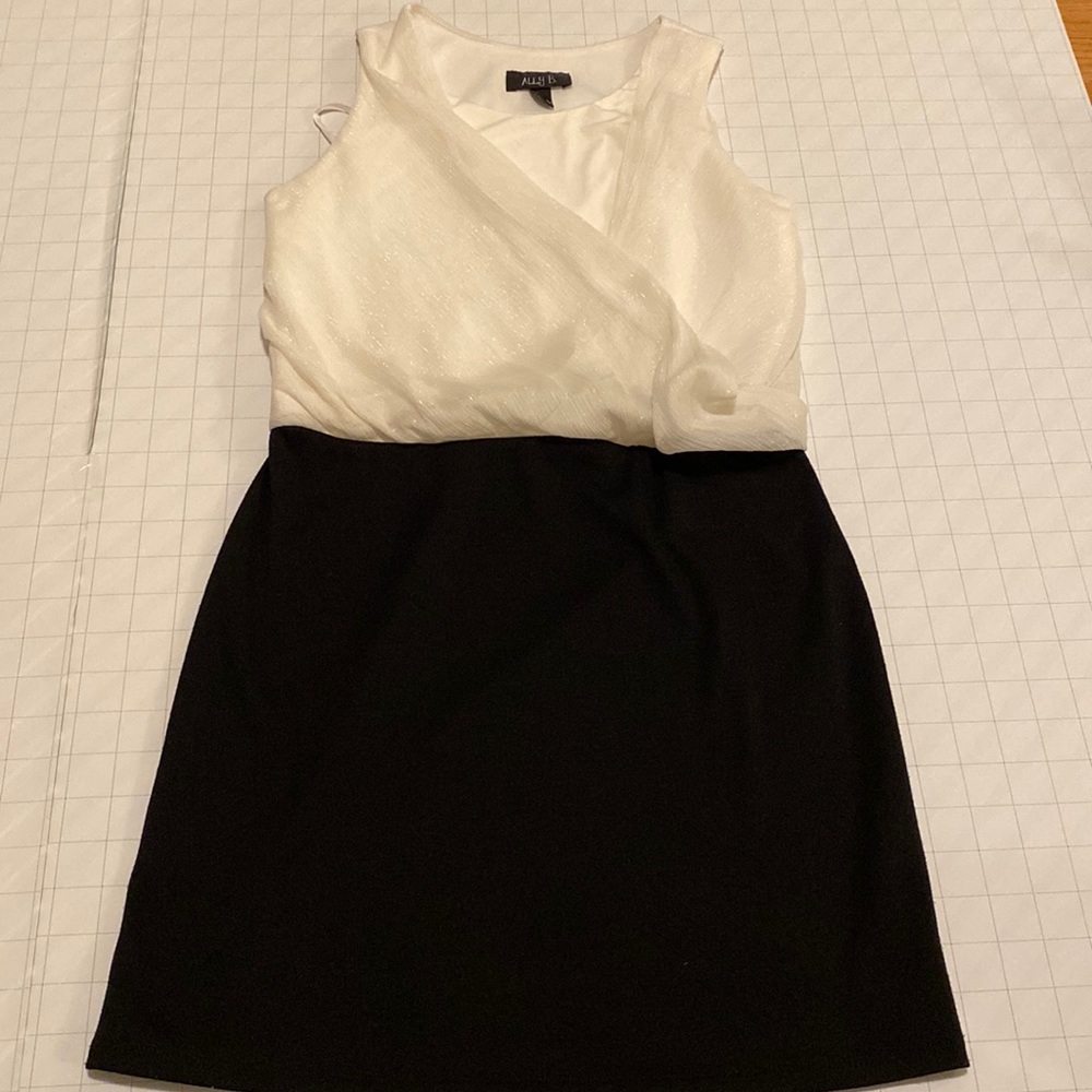 Black and white minidress with glitter accent on top